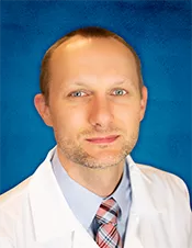 Dr. Travis Schuller.